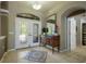 Elegant entryway with double doors and a decorative rug at 3395 Hardee Dr, Venice, FL 34292