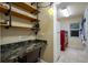 Laundry room with desk and shelves at 3395 Hardee Dr, Venice, FL 34292