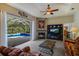 Living room with fireplace, pool view, and sliding doors at 3395 Hardee Dr, Venice, FL 34292