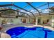 Enclosed pool with patio and house view at 3395 Hardee Dr, Venice, FL 34292