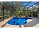 Enclosed kidney-shaped pool with brick patio at 3395 Hardee Dr, Venice, FL 34292