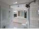 Modern bathroom with a large shower, vanity, and toilet at 3491 Bayou Sound, Longboat Key, FL 34228