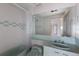 Retro bathroom with light green fixtures and a shower/tub combo at 3491 Bayou Sound, Longboat Key, FL 34228