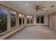 Spacious bedroom with sunset views and ceiling fan at 3491 Bayou Sound, Longboat Key, FL 34228