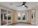 Bright bedroom with water views and sliding glass doors at 3491 Bayou Sound, Longboat Key, FL 34228