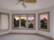 Bright bedroom with sunset views and a ceiling fan at 3491 Bayou Sound, Longboat Key, FL 34228