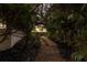 Stone path through lush landscaping leads to the waterfront at 3491 Bayou Sound, Longboat Key, FL 34228