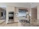 Modern kitchen with stainless steel appliances and granite island at 3491 Bayou Sound, Longboat Key, FL 34228