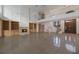 Two story living room with a grand chandelier and fireplace at 3491 Bayou Sound, Longboat Key, FL 34228