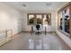 Bright home office with large windows and glass shelving at 3491 Bayou Sound, Longboat Key, FL 34228