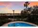 Inviting pool with scenic water views at sunset at 3491 Bayou Sound, Longboat Key, FL 34228