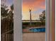 View of a private pool and surrounding landscape at sunset at 3491 Bayou Sound, Longboat Key, FL 34228