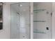 Large walk-in shower with glass enclosure and built-in shelving at 3491 Bayou Sound, Longboat Key, FL 34228