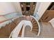 Elegant curved staircase with glass and wood accents at 3491 Bayou Sound, Longboat Key, FL 34228