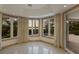 Sunroom with water views and sliding doors to the patio at 3491 Bayou Sound, Longboat Key, FL 34228