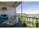 Spacious balcony overlooking lake with grill and seating at 3951 Lake Bayshore Dr # F408, Bradenton, FL 34205