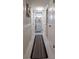 Bright hallway with marble floors and access to multiple rooms at 3951 Lake Bayshore Dr # F408, Bradenton, FL 34205