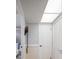 Light hallway with white doors and a linen closet at 3951 Lake Bayshore Dr # F408, Bradenton, FL 34205