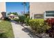 Walkway leading to clubhouse with landscaping at 3951 Lake Bayshore Dr # F408, Bradenton, FL 34205