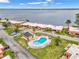 Aerial view showing property's waterfront location and kidney-shaped pool at 4108 La Costa Cv, Bradenton, FL 34210