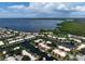 Aerial view of waterfront community with tennis courts and a pool nearby at 4108 La Costa Cv, Bradenton, FL 34210