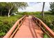 Wooden boardwalk leading to a tranquil waterfront view at 4108 La Costa Cv, Bradenton, FL 34210