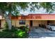 Condo exterior with carport and lush landscaping at 4108 La Costa Cv, Bradenton, FL 34210