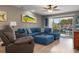 Spacious living room with comfortable sectional sofa and water views at 4108 La Costa Cv, Bradenton, FL 34210