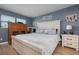 Serene main bedroom with a king-size bed and coastal decor at 4108 La Costa Cv, Bradenton, FL 34210