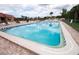 Inviting community swimming pool with plenty of lounge chairs at 4108 La Costa Cv, Bradenton, FL 34210