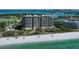 Aerial view of beachfront high-rise building with Gulf views at 415 L Ambiance Dr # A401, Longboat Key, FL 34228