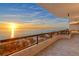 Expansive balcony overlooking the ocean and beach at sunset at 415 L Ambiance Dr # A401, Longboat Key, FL 34228