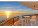 Stunning sunset view from private balcony with oceanfront seating at 415 L Ambiance Dr # A401, Longboat Key, FL 34228