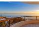 Oceanfront balcony view at sunrise with beautiful sky at 415 L Ambiance Dr # A401, Longboat Key, FL 34228