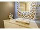 Elegant bathroom featuring a modern sink and mosaic tile at 415 L Ambiance Dr # A401, Longboat Key, FL 34228