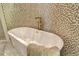 Relaxing bathroom featuring a large soaking tub and mosaic tile at 415 L Ambiance Dr # A401, Longboat Key, FL 34228