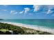 Expansive beach view with white sand and ocean at 415 L Ambiance Dr # A401, Longboat Key, FL 34228