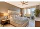 Bright bedroom with king-size bed and access to a balcony at 415 L Ambiance Dr # A401, Longboat Key, FL 34228