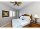 Spacious bedroom with a king-size bed and wooden furniture at 415 L Ambiance Dr # A401, Longboat Key, FL 34228