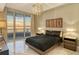 Bedroom with king-size bed and ocean views at 415 L Ambiance Dr # A401, Longboat Key, FL 34228