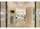 Bright and spacious entryway with marble floors and modern chandelier at 415 L Ambiance Dr # A401, Longboat Key, FL 34228