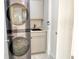 Convenient laundry room with stackable washer and dryer at 415 L Ambiance Dr # A401, Longboat Key, FL 34228