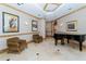 Lobby with two armchairs and a grand piano at 415 L Ambiance Dr # A401, Longboat Key, FL 34228