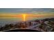 Stunning sunset view over the ocean and sandy beach at 415 L Ambiance Dr # A401, Longboat Key, FL 34228