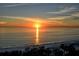 Breathtaking sunset over the ocean and sandy beach at 415 L Ambiance Dr # A401, Longboat Key, FL 34228