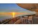 Breathtaking sunset view from a condo balcony overlooking the ocean at 415 L Ambiance Dr # A401, Longboat Key, FL 34228