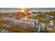 Aerial view of waterfront townhomes at sunrise at 4238 Marina View Way, Cortez, FL 34215