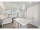 Modern kitchen with white cabinets, quartz island, and pendant lighting at 4238 Marina View Way, Cortez, FL 34215