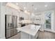 Modern kitchen featuring stainless steel appliances and an island at 4238 Marina View Way, Cortez, FL 34215