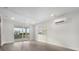 Bright living room with sliding glass doors leading to a balcony at 4238 Marina View Way, Cortez, FL 34215